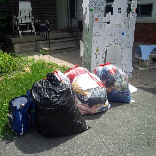 Five bags for donation - staged in front of the girls' chateau, which needed to be moved outside for cleaning purposes.